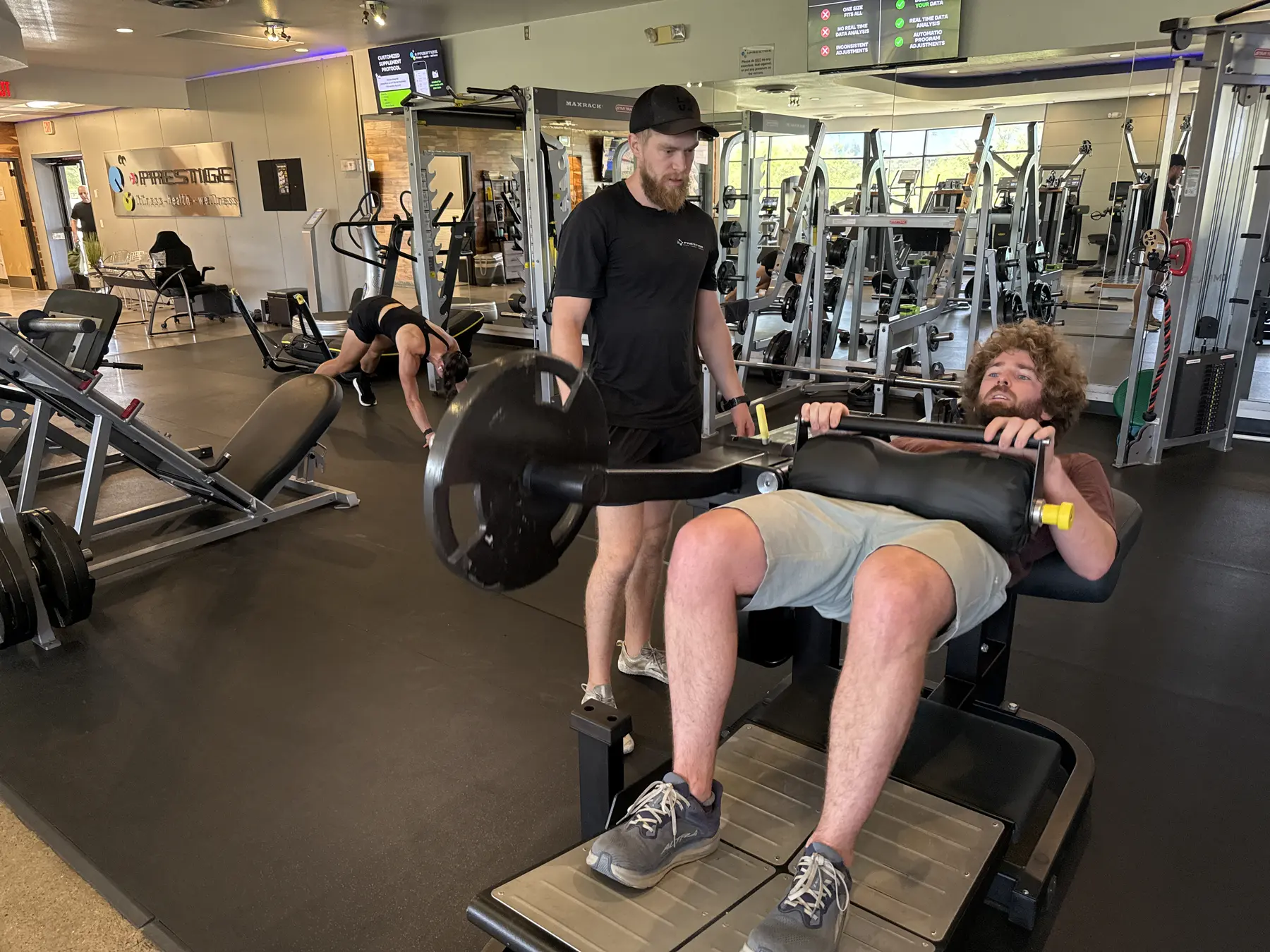 Client performing a hip thrust in personal training at Prestige Fitness