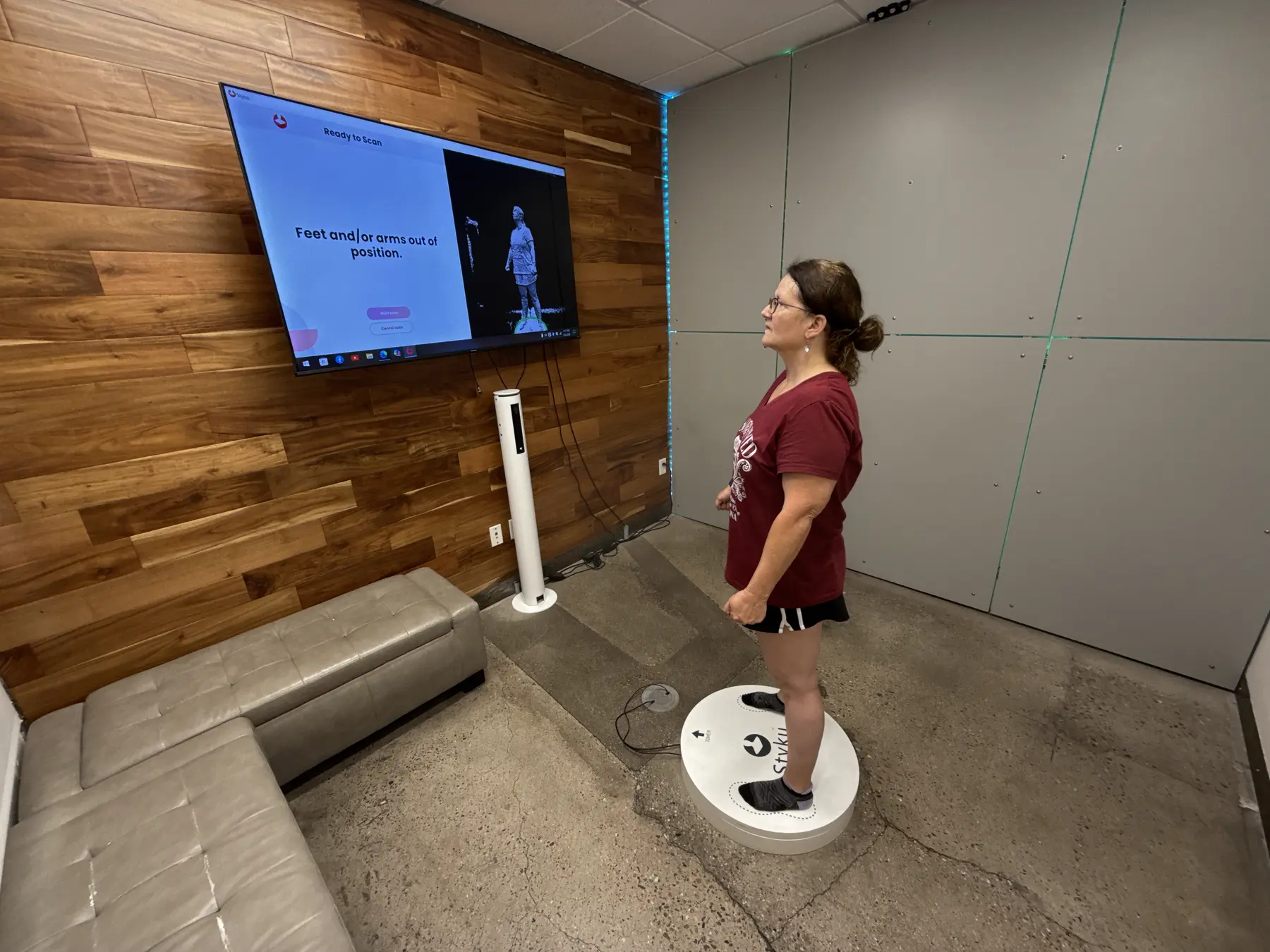 A Prestige Fitness client completing a Styku 3D body scan in the assessment room