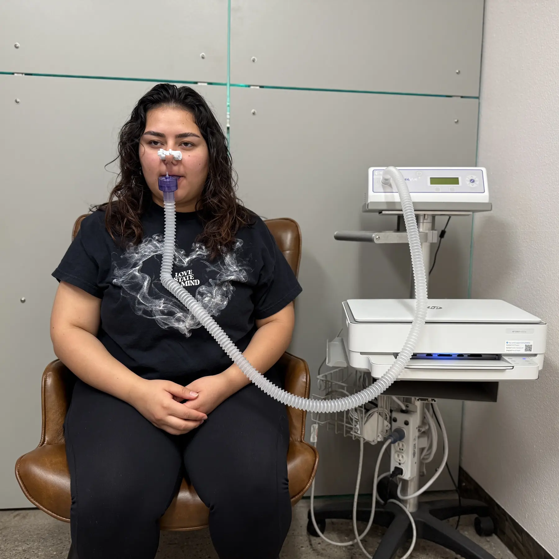 A Prestige Fitness client completing a KORR ReeVue resting-metabolism measurement
